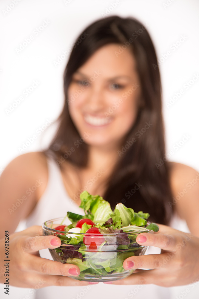 Attractive smiling woman eating salat Attractive smiling woman eating salat