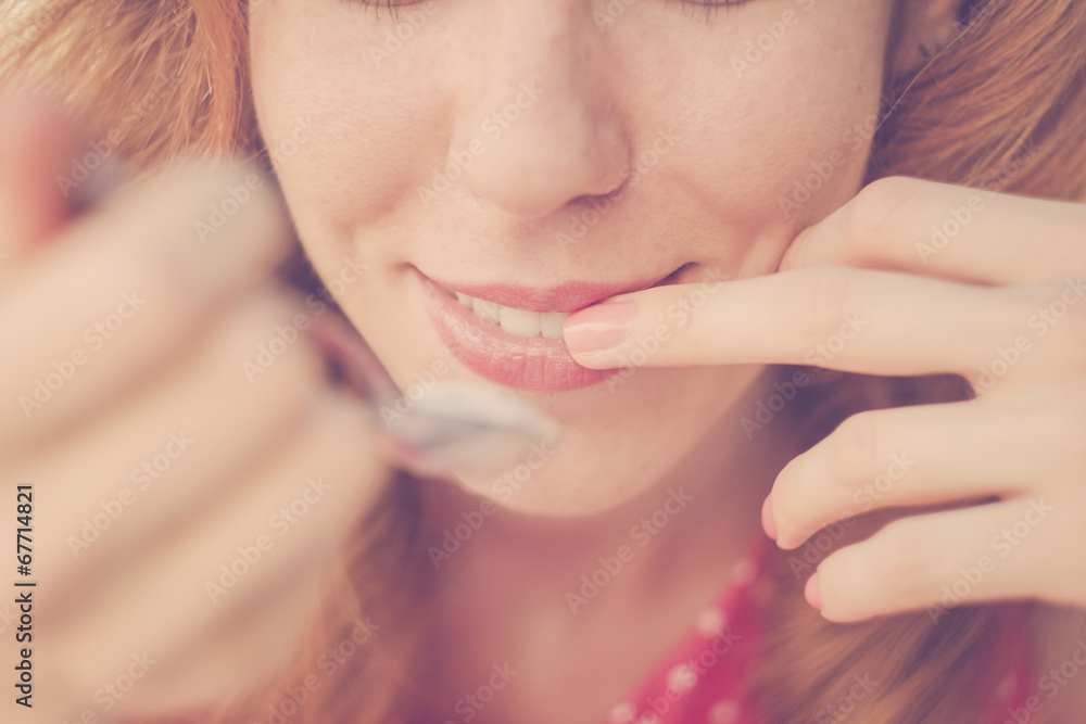 Beautiful Pin-Up Girl eating ice cream, close up Beautiful Pin-Up Girl eating ice cream, close up