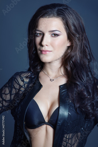 Brunette beautiful girl posing in black lingerie