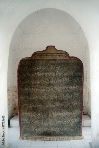 Marble stone slabsof Buddhist cannon ( Tripitaka texts ). photo