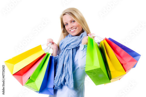blonde woman with colorful shopping bags