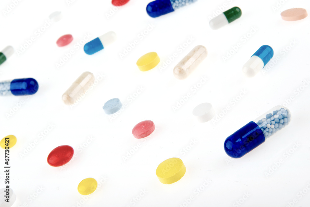 Color pills and capsules background isolated on white background Color pills and capsules background isolated on white background