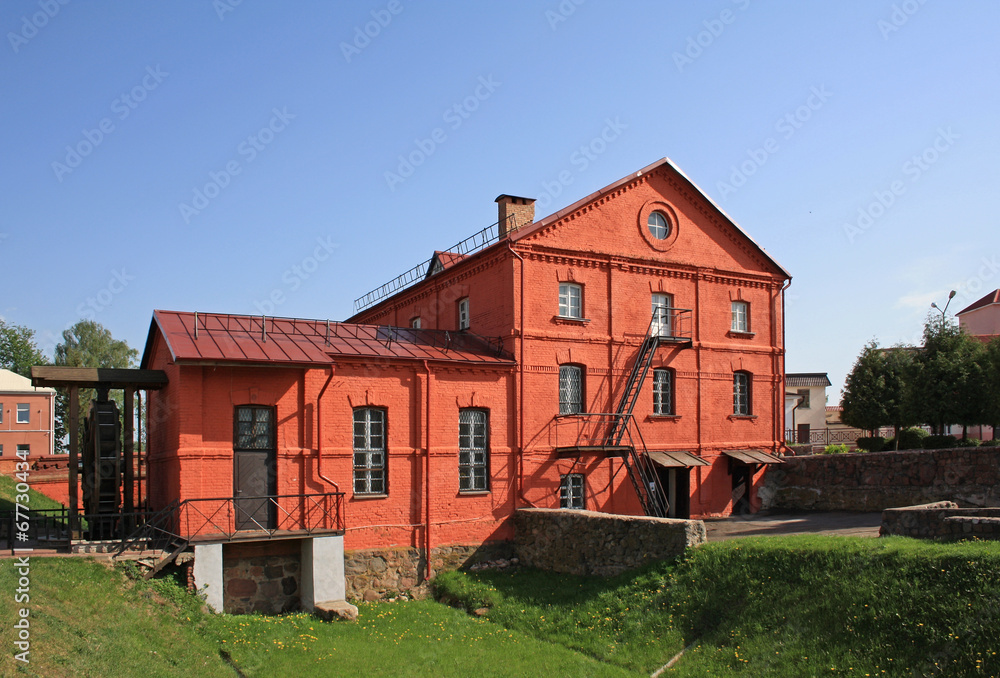 Fototapeta premium Red watermill building in Orsha