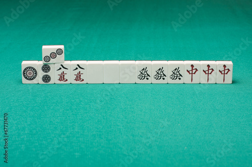 Smooth table surface with a mahjong on it