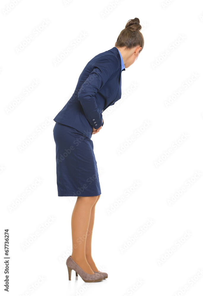 Full length portrait of business woman with stomach ache Full length portrait of business woman with stomach ache