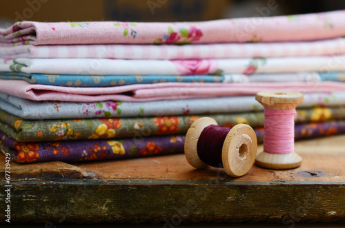 Wooden thread spools and floral pattern fabric set