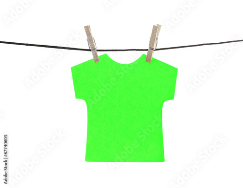 Flat green T-shirt sticky note hanged, isolated photo