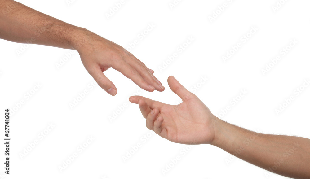 Two male hands reaching towards each other. Isolated