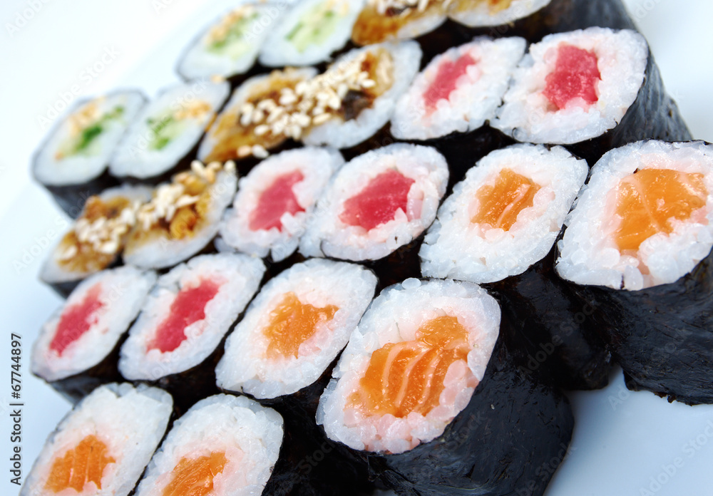 Roll made salmon, eel, tuna, vegetables Roll made salmon, eel, tuna, vegetables