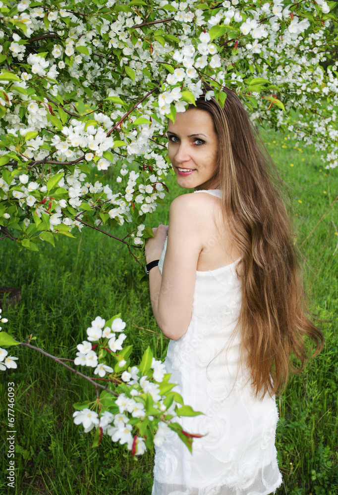 Portrait of beautiful woman with apple tree flowers Portrait of beautiful woman with apple tree flowers