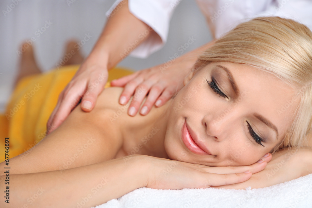 Beautiful young woman having massage in spa salon Beautiful young woman having massage in spa salon