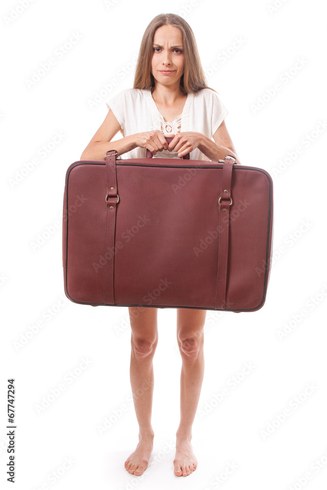 woman lifts a heavy suitcase, isolated on white woman lifts a heavy suitcase, isolated on white