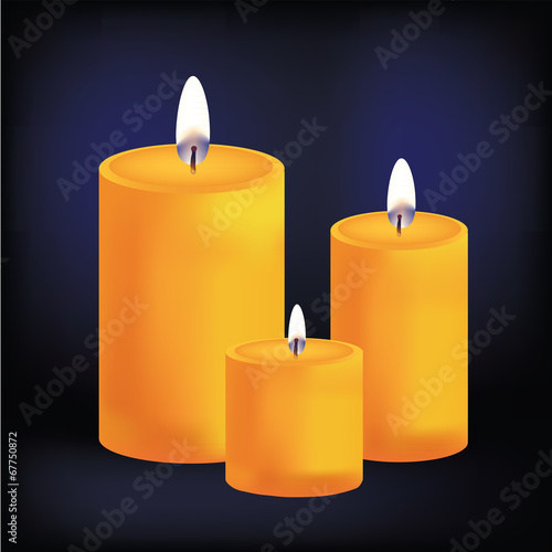 Realistic three yellow candles