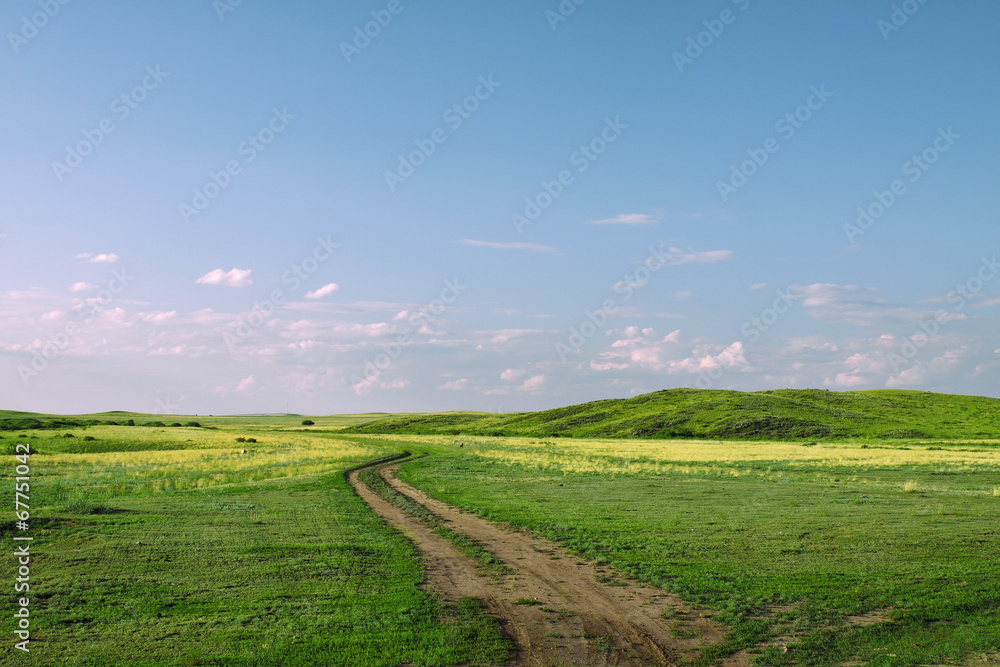Road in steppe hills
