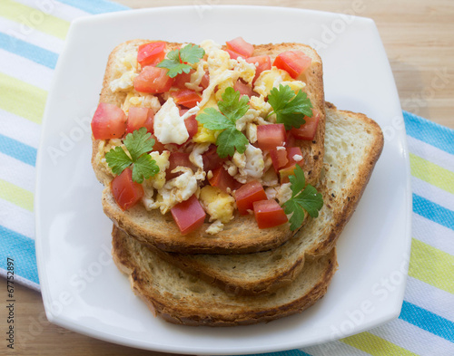 toast with egg, tomato and parsley