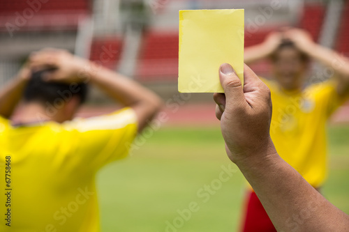 Football Referee warning and recorded photo