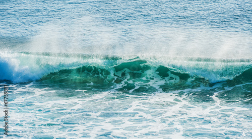 swirled blue colored ocean wave