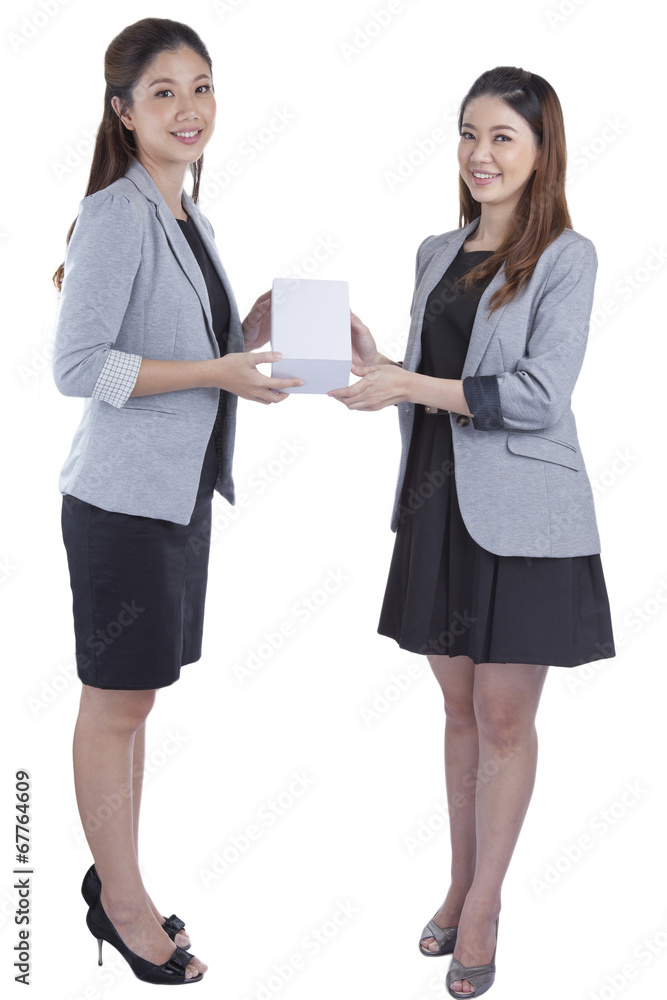 businesswomen giving a box to her businesswomen giving a box to her