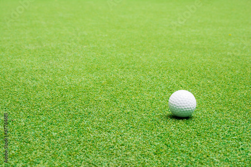 Golf ball on the green grass.