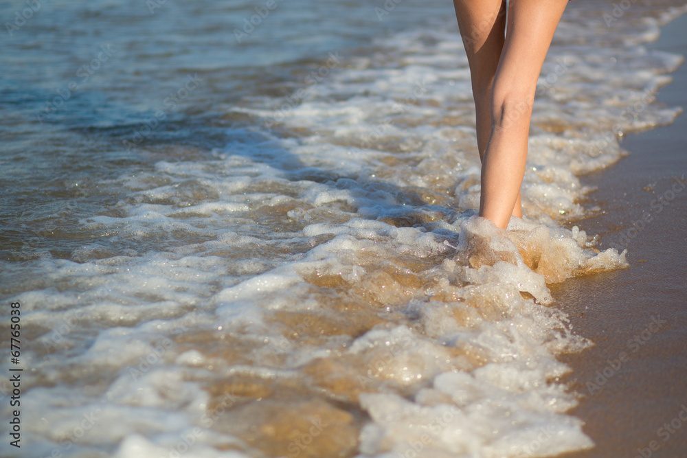 Young woman walking on the beach Young woman walking on the beach
