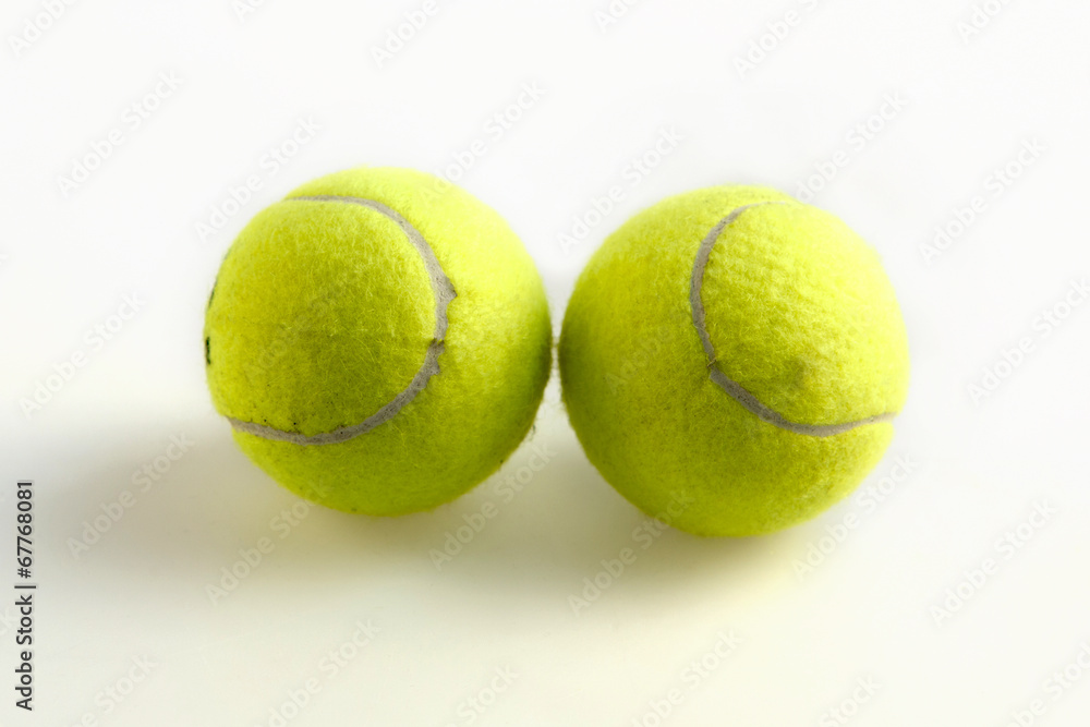 green tennis balls on a white background