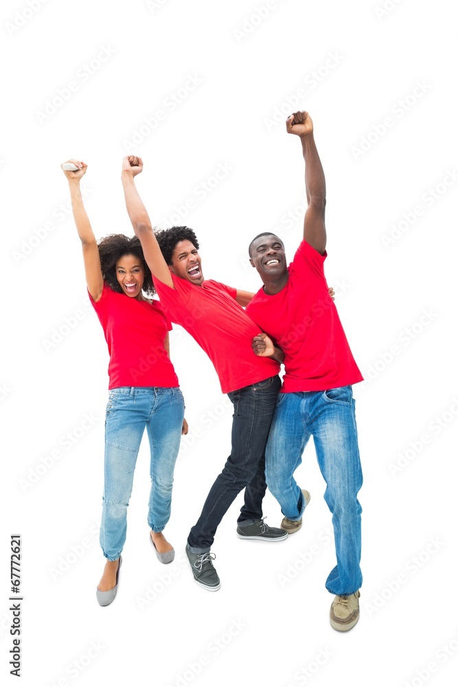 Excited football fans in red cheering Excited football fans in red cheering