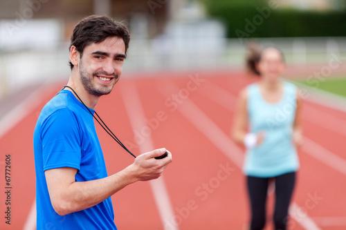 Tableau sur toile Sport coach training a young attractive woman