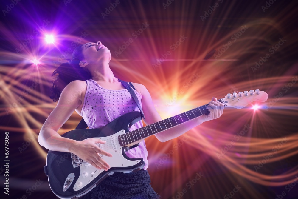 Composite image of pretty girl playing guitar