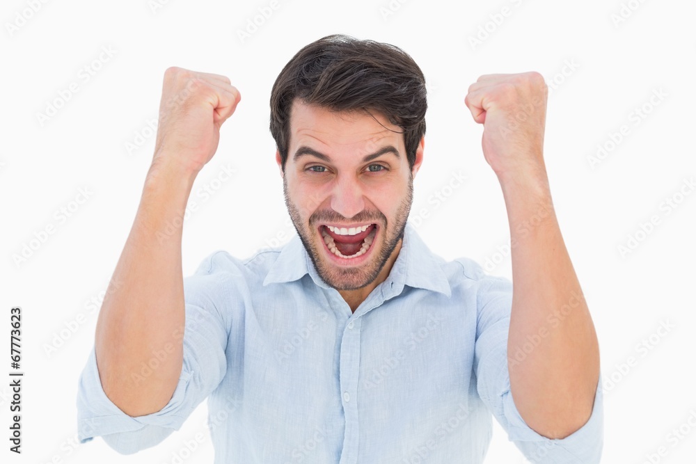 Cheering man looking at camera Cheering man looking at camera