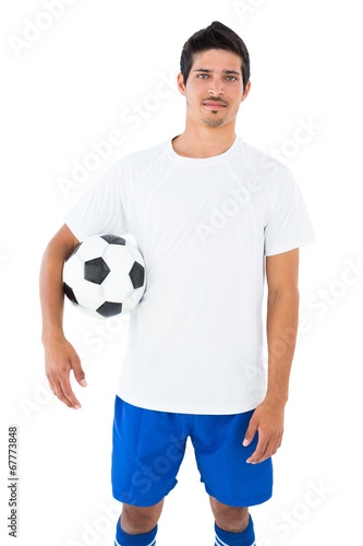 Football player in white holding ball