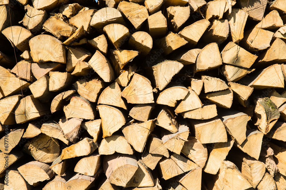 Pile of chopped firewood prepared for winter Pile of chopped firewood prepared for winter