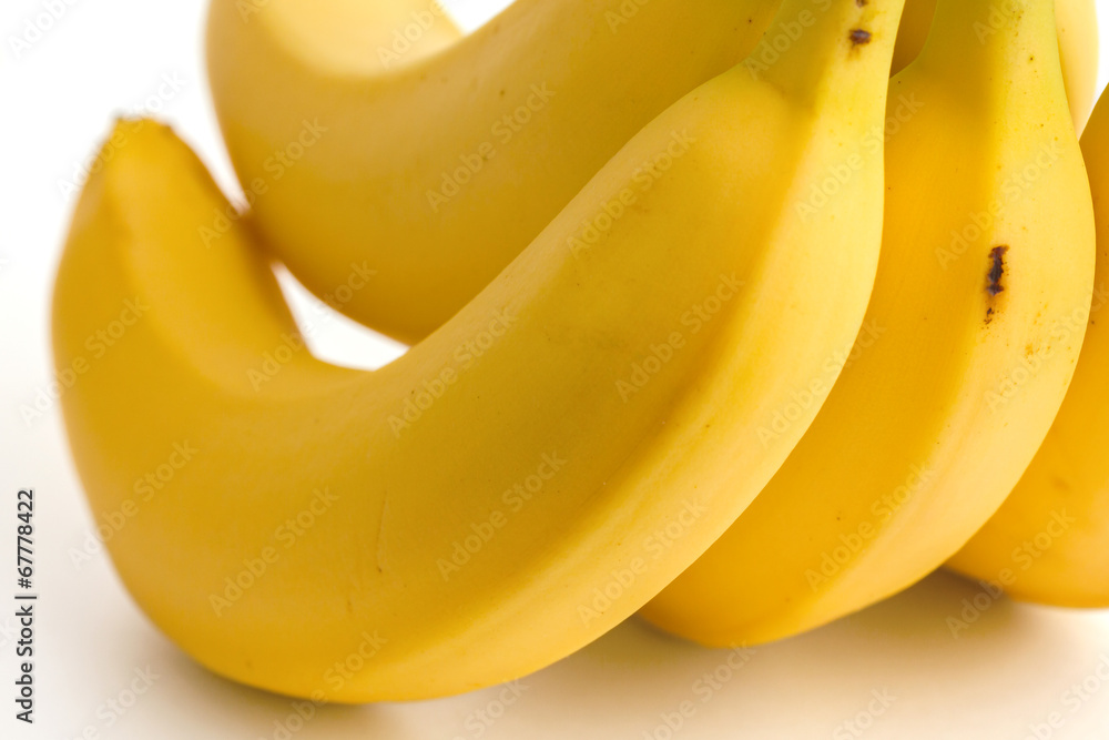 Detail on a bunch of bananas with slight bruising. Detail on a bunch of bananas with slight bruising.