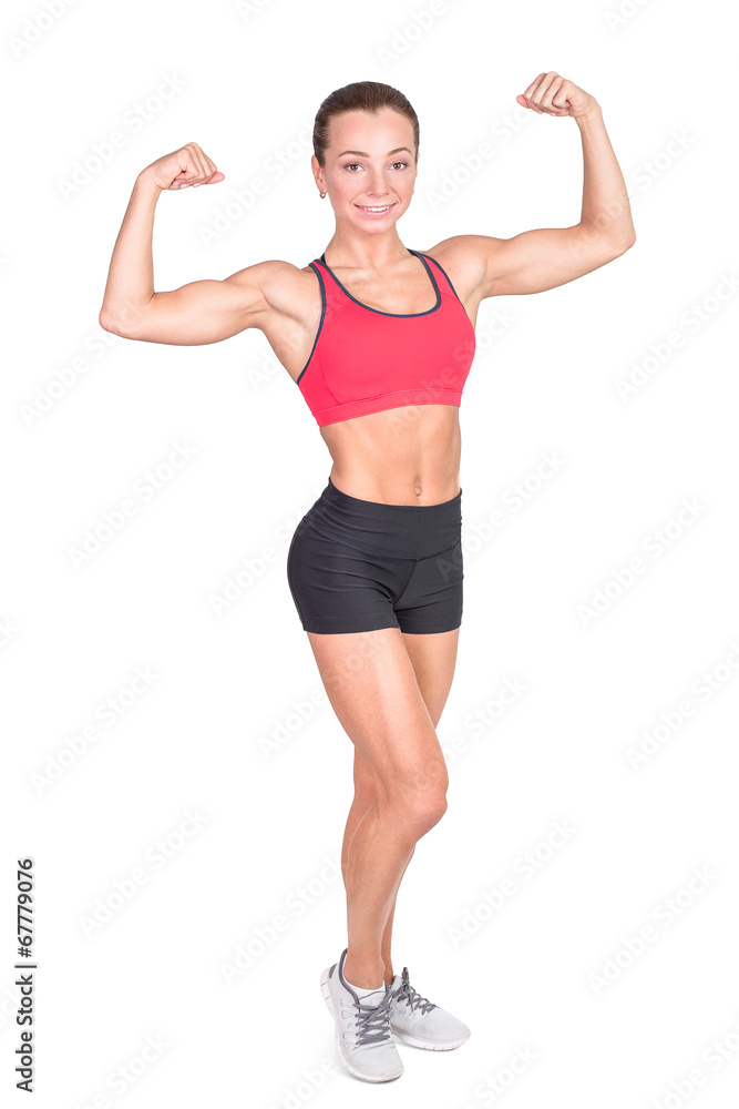 Athletic young woman showing muscles of the back and hands Athletic young woman showing muscles of the back and hands