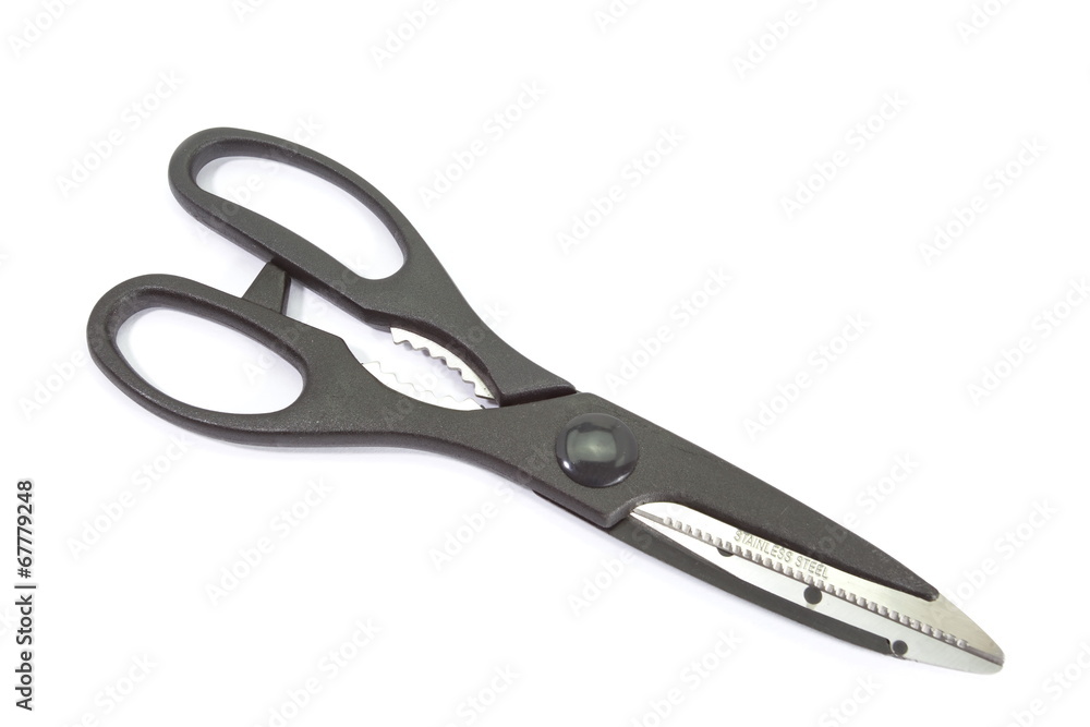 Close - up black metal scissor on white background Close - up black metal scissor on white background