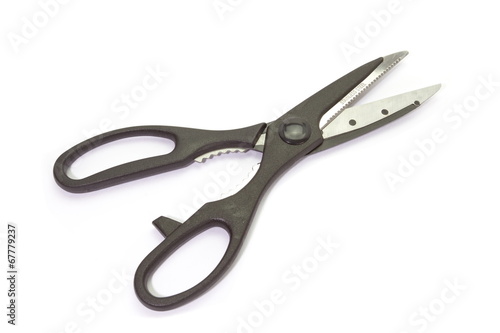 Close - up black metal scissor on white background