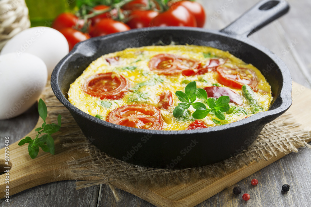 Omelet with vegetables and cheese. Frittata