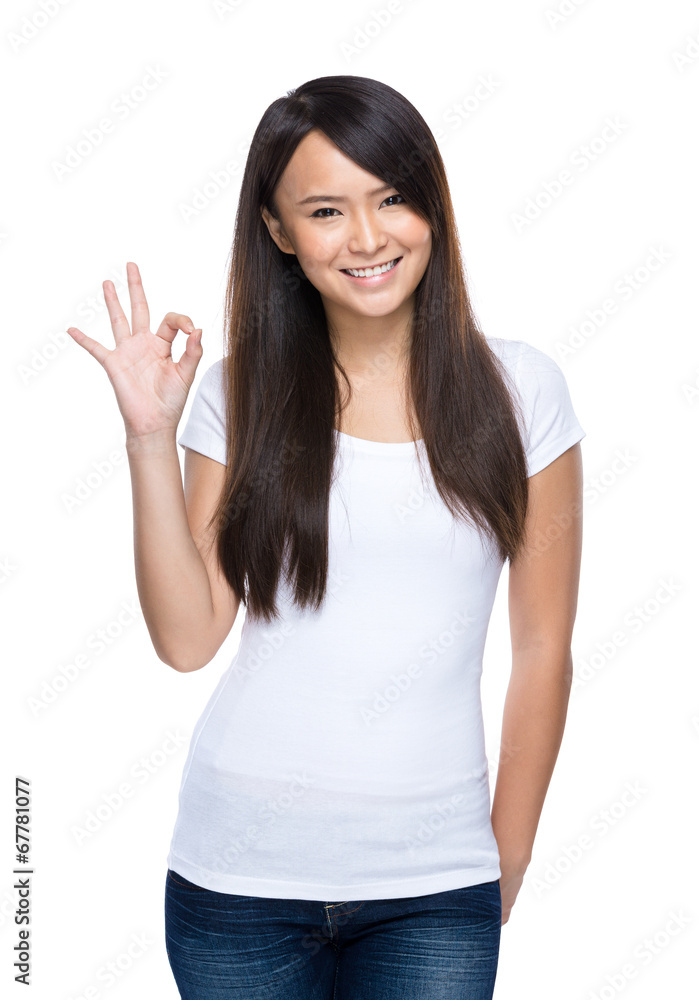 Young asian woman ok sign on white background Young asian woman ok sign on white background