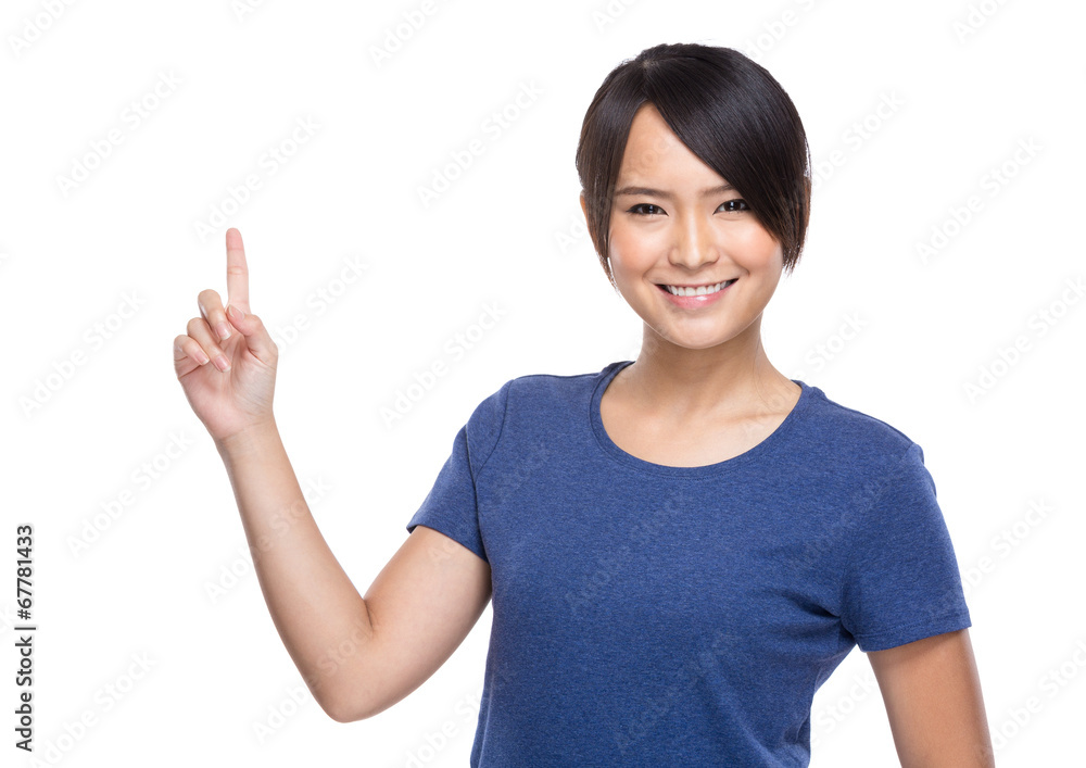 Young woman pointing up smiling on white background Young woman pointing up smiling on white background
