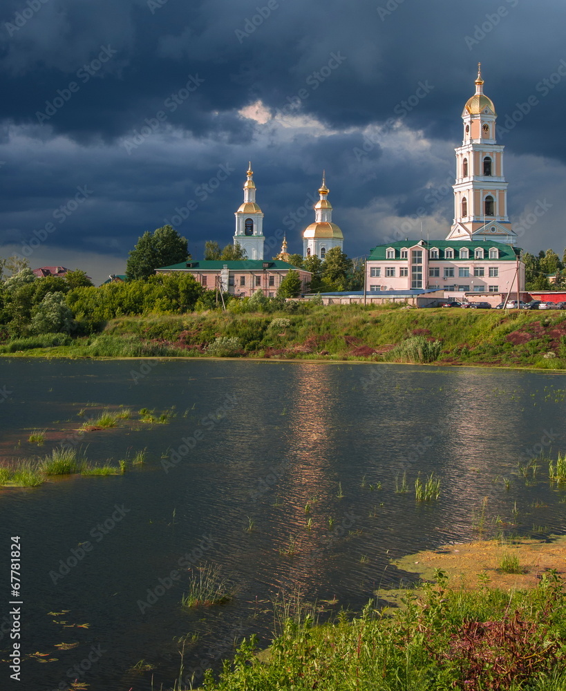 Storm over Trinity Monastery on lakeside in Diveevo