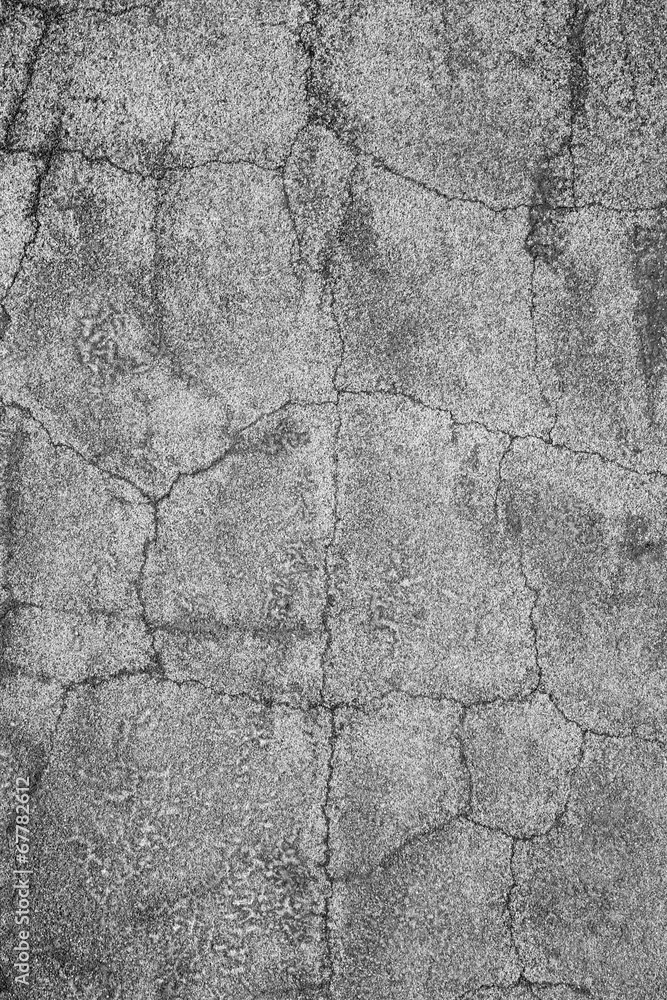 Concrete wall with cracks.