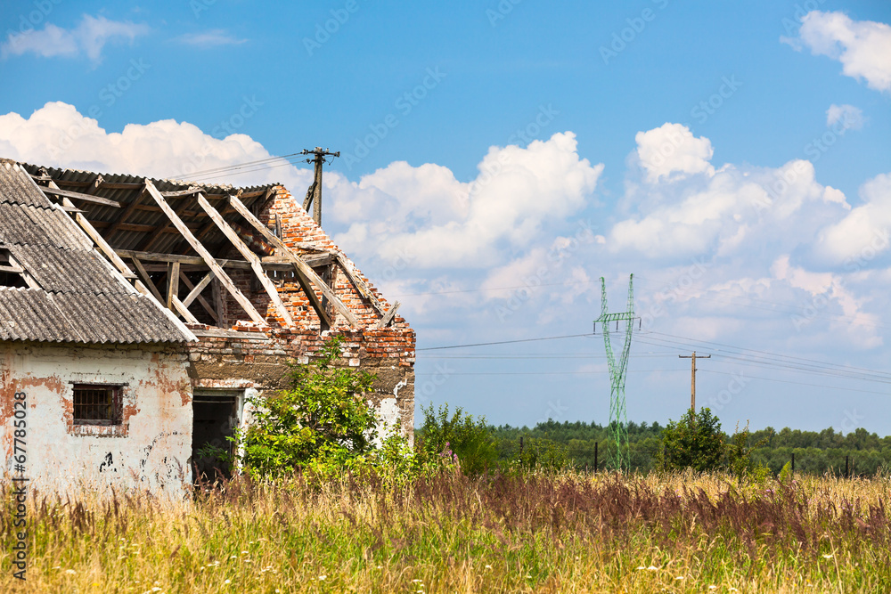 Abandoned farm house in a field