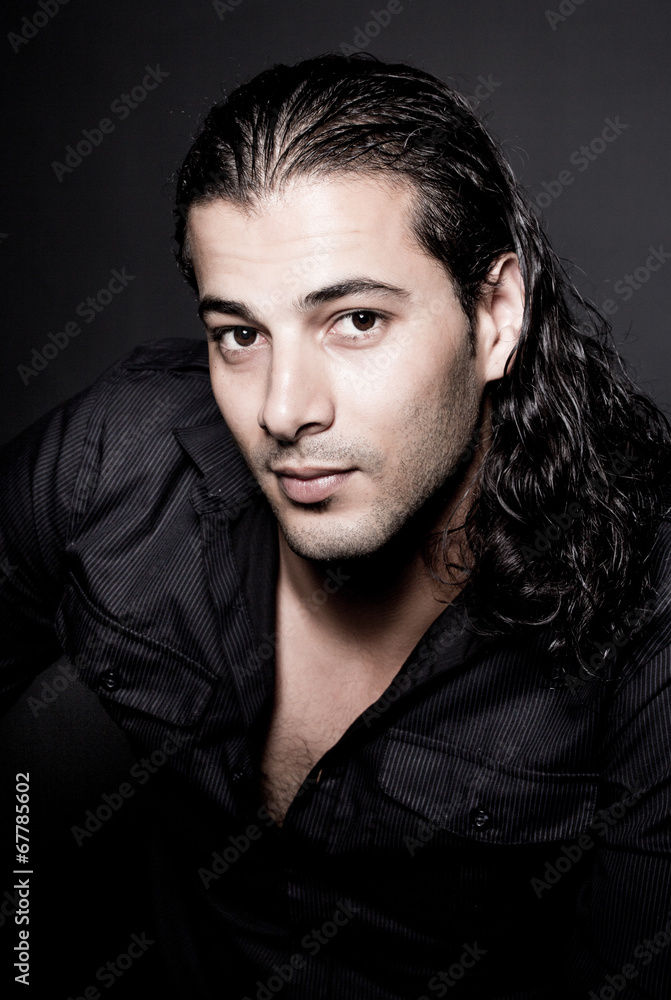 Portrait of young elegant man in the black shirt Portrait of young elegant man in the black shirt