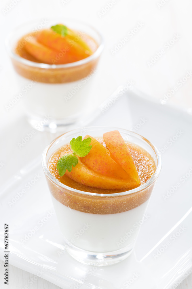 dessert with cream and apricot jelly in glasses on plate dessert with cream and apricot jelly in glasses on plate