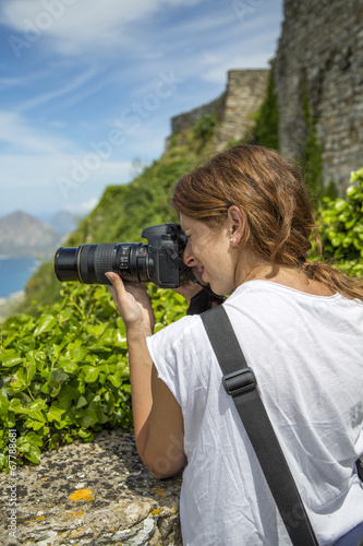 Young woman with camera