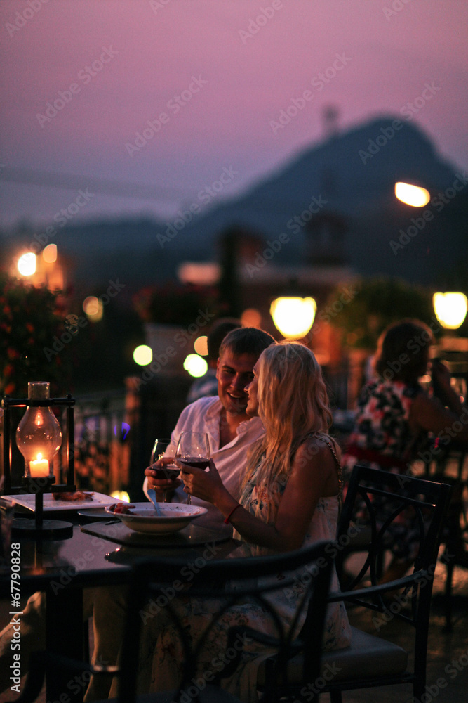 Beautiful couple eating at restaurant outside