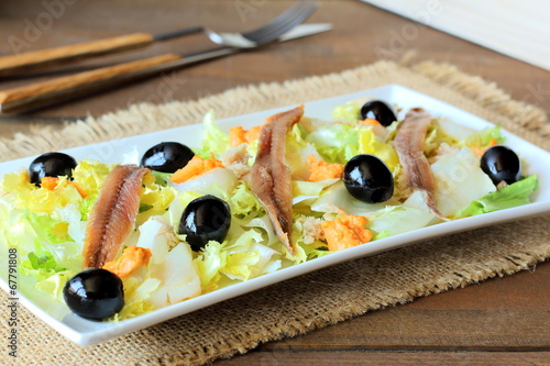 Cod, anchovies, and black olives salad