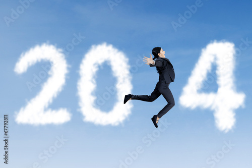 Wallpaper Mural Happy businesswoman jumps with clouds of 2014 Torontodigital.ca