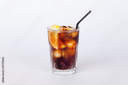 cola cocktail with lemon and ice