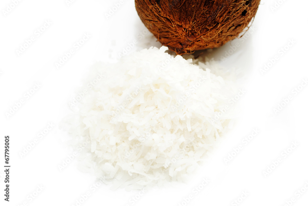 Shredded Coconut with a Whole Coconut in the Background Shredded Coconut with a Whole Coconut in the Background