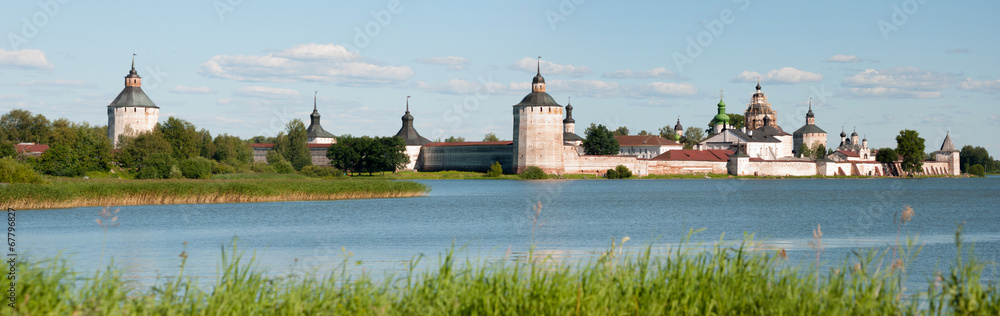 Ancient russian monastery at the lake bank in summer